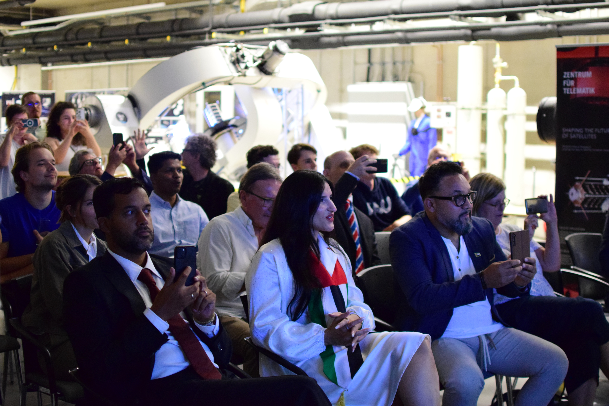 Guests, partners and colleagues are eagerly following the launch of the rocket in the livestream.